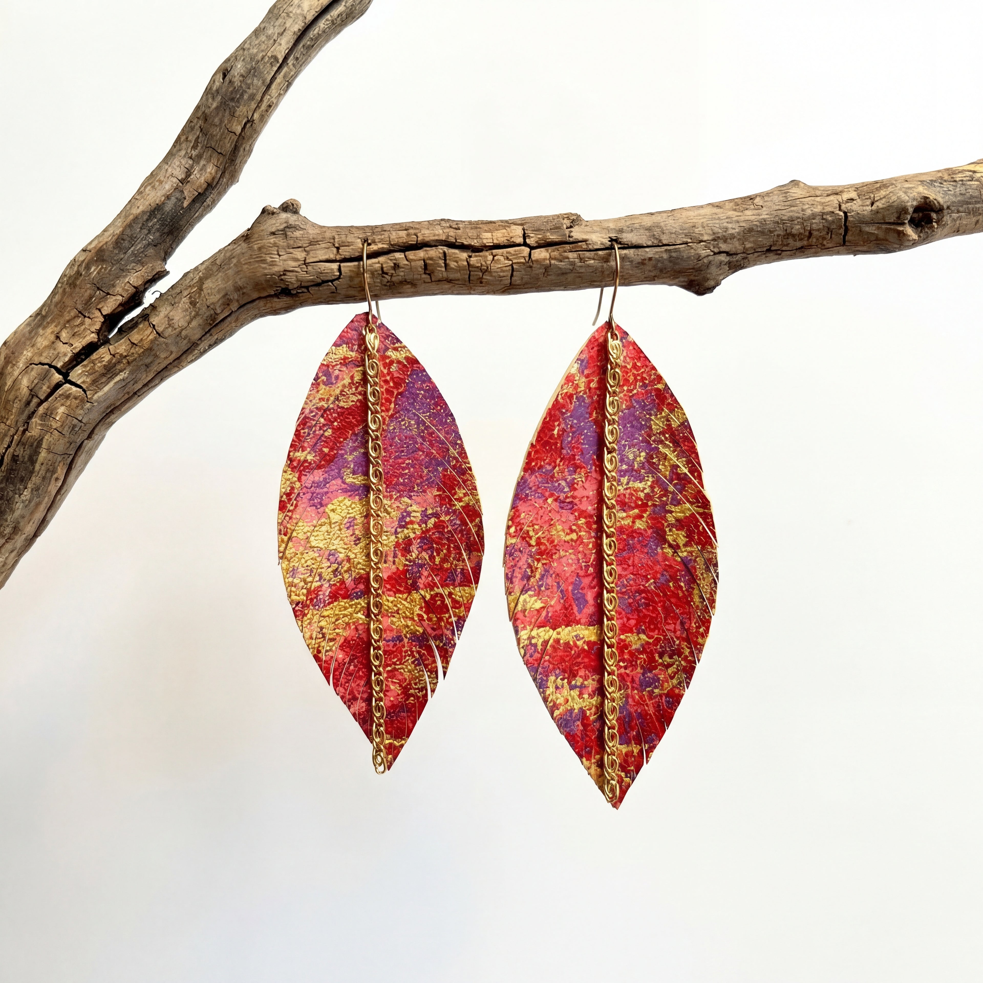 עגילי נוצה מאת שירז פלד