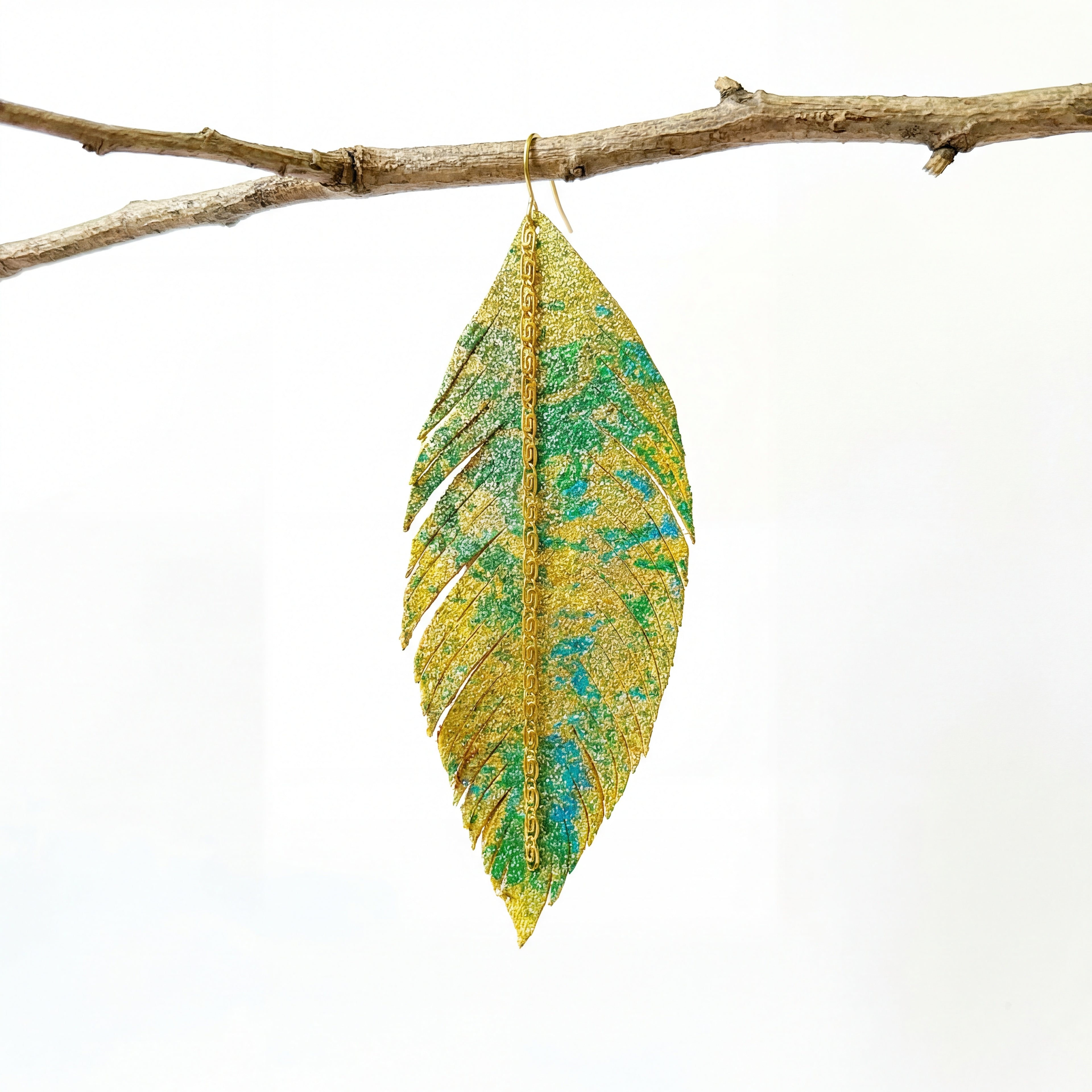 עגילי נוצה מאת שירז פלד